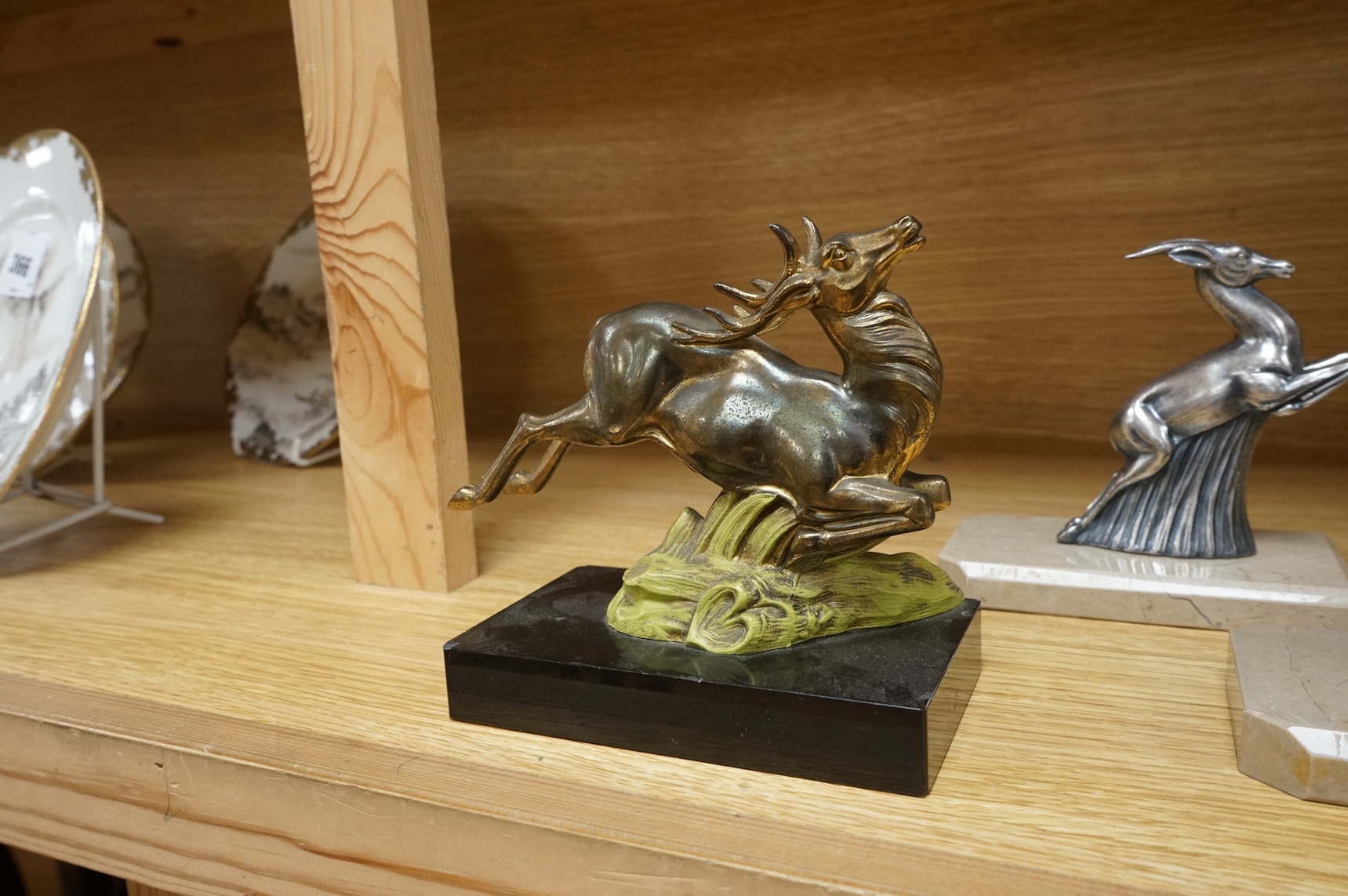 Two pairs of Art Deco bookends in the form of leaping animals, largest 14cm wide